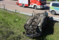 New The BMW goes off the roadway and overturns
